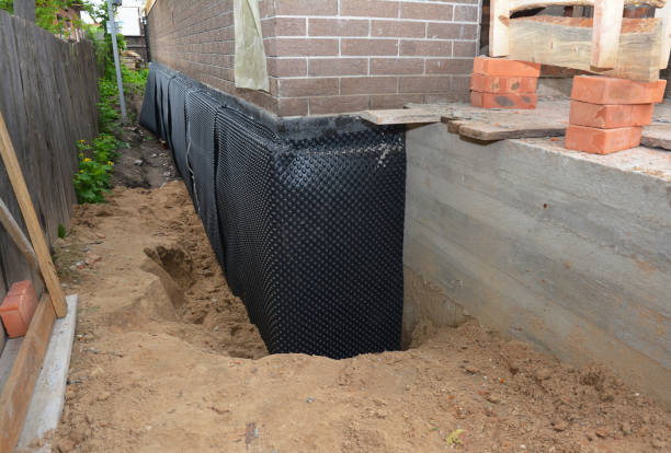 Happy homeowners after waterproofing job in Westland